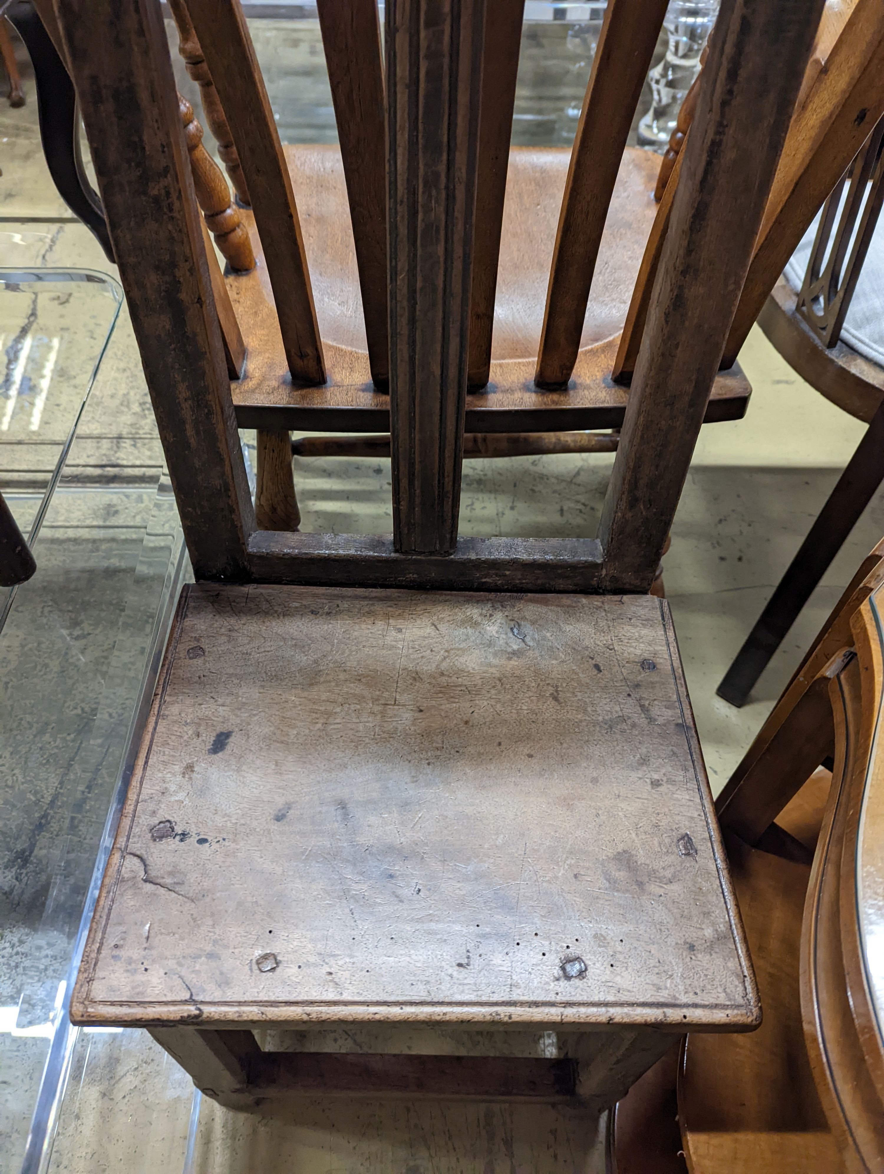 Two antique walnut or pine backstools.